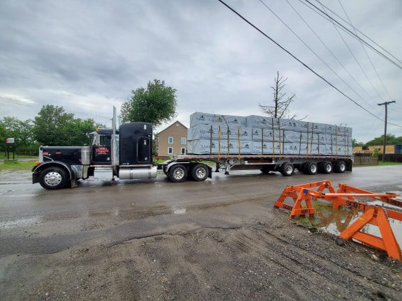 A Large Truck Moving On The Road